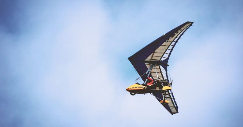 Hang Glider - Yellow and Black Plane Under Blue Clouds