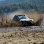 Outback Destinations - A car driving through mud on a lake