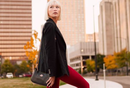 Red Centre - Woman Posing in Red Tights and Black Jacket in Office District