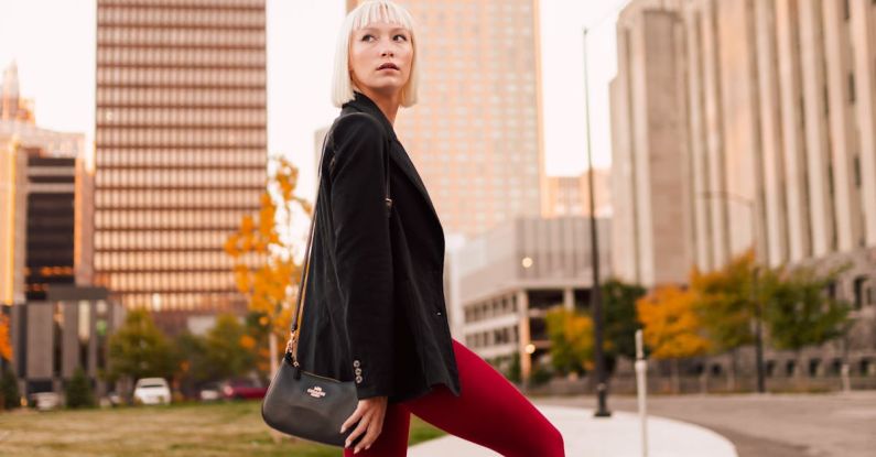 Red Centre - Woman Posing in Red Tights and Black Jacket in Office District
